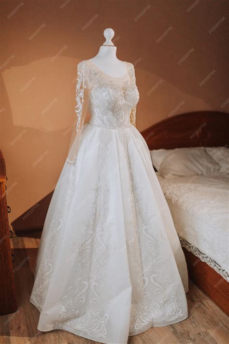 Premium Photo | A luxurious lace wedding dress in an expensive interior