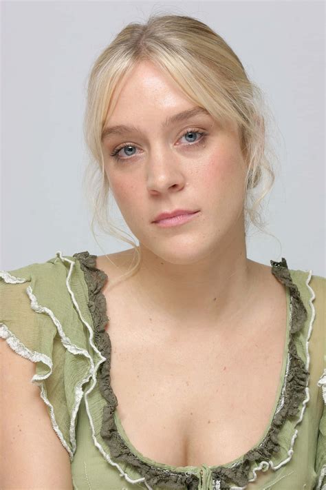 Download Chloë Sevigny striking a pose in a stylish ensemble Wallpaper
