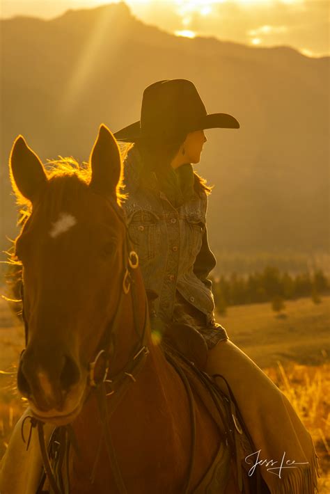 Wyoming Cowgirl looking back into the autumn afternoon. | Wyoming | USA