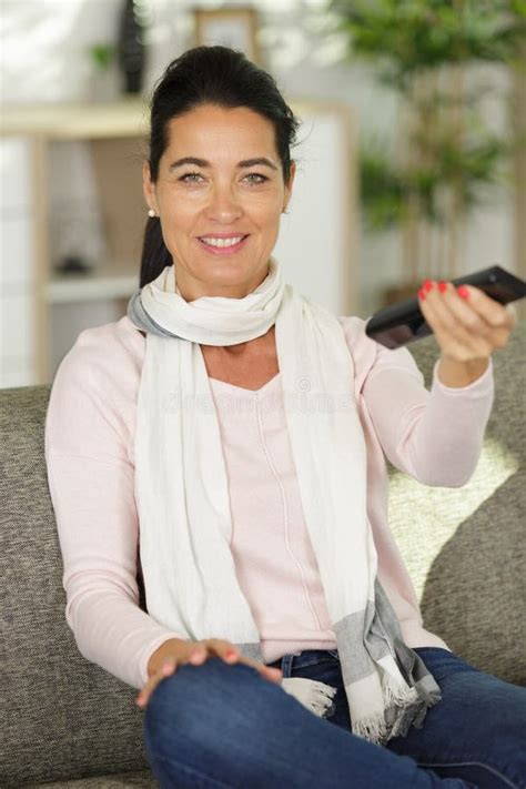 Beautiful Woman Watching Tv Sitting on Couch at Home Stock Photo ...