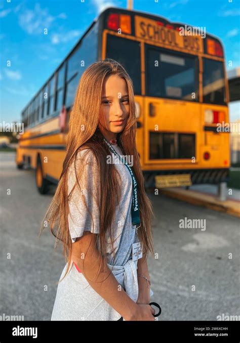 beautiful teen girl   school bus stock photo alamy