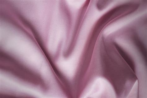 Premium Photo | A closeup of pink fabric of shirt