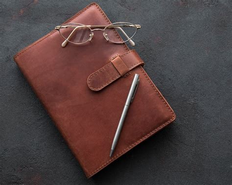 Premium Photo | Brown leather notebook