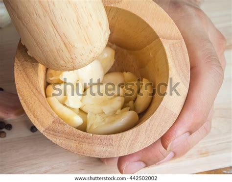 pounding garlic  knife images stock  vectors