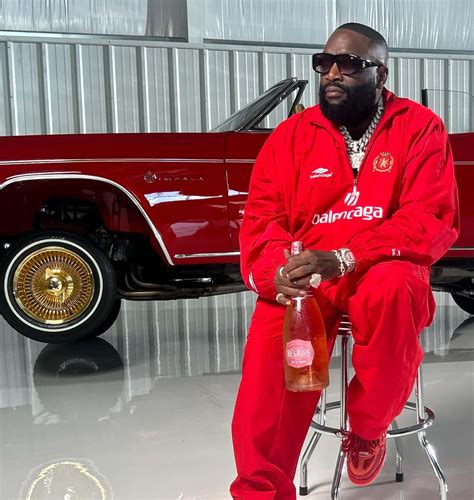 Download Rick Ross Red Outfit Impala Belaire Wallpaper | Wallpapers.com