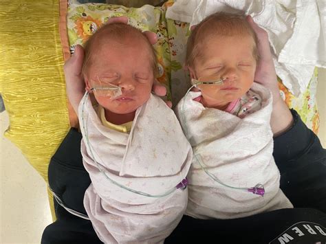 First side by side of week-old identical twin girls (born at 33+2)… to