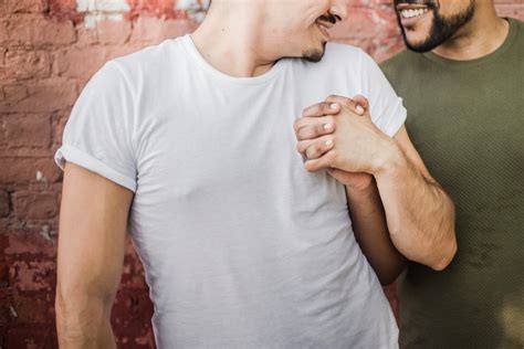 Close Up Photo of Men Holding Hands · Free Stock Photo