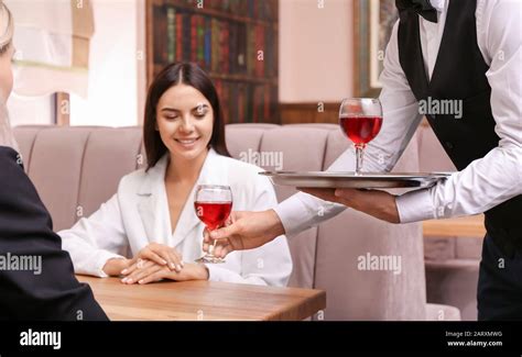 waiter serving client  restaurant stock photo alamy