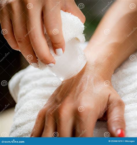 Wrist injury Ice Massage stock photo. Image of hands - 253461674