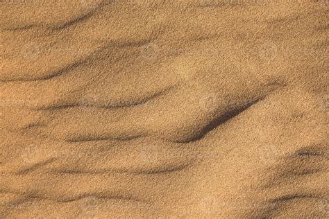 Texture of sand in the desert close-up background. A dune with a ...