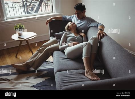 romantic couple relaxing  sofa  res stock photography  images