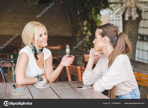 women talking  cafe bar stock photo  crilueda