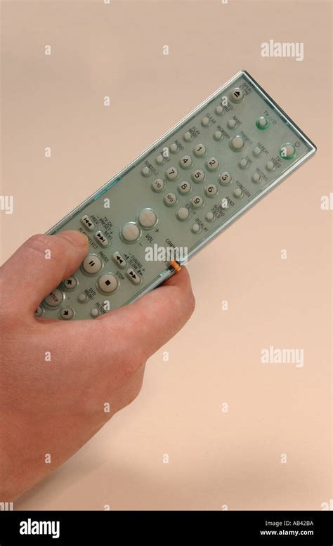 hand holding remote control stock photo alamy