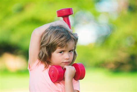 Premium Photo | Sport child boy with strong biceps muscles kids ...