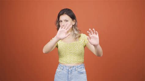 fear reaction  woman   camera coward woman  stock