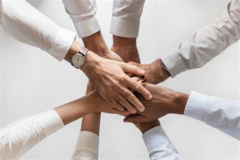 diverse people joining hands  teamwor royalty  stock