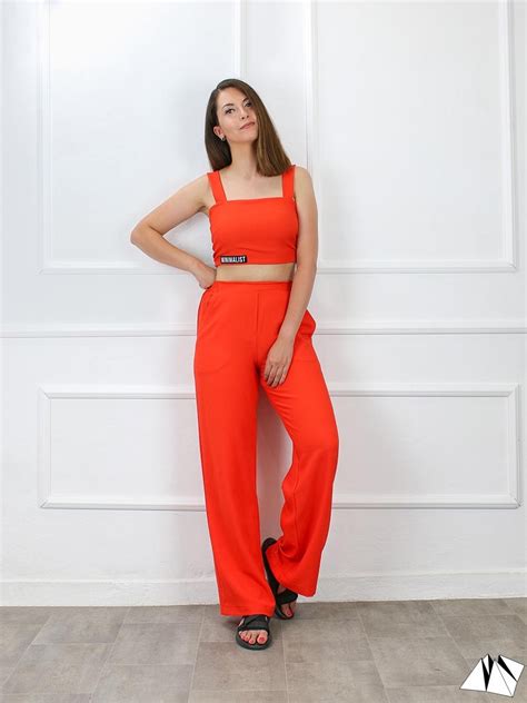 wide leg burnt orange pants fold  mind