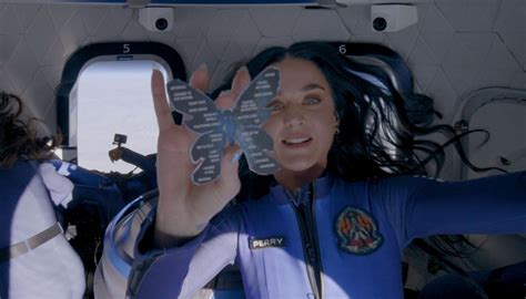 Katy Perry stuns as she poses in skin-tight blue dress after space trip