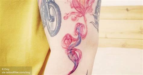 Aladdin's genie lamp tattoo on the left arm.