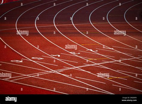 Red Track with Precise White Lines and Sequential Numbers: A Visual Representation of Athletic ...
