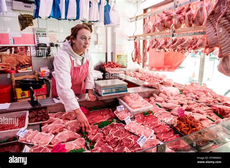 woman butcher shop happy female butcher holding large ham   canva