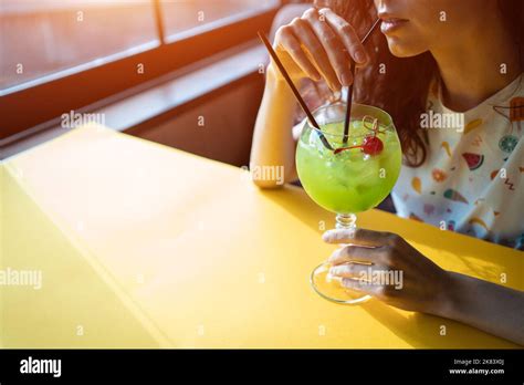 fresh green midori sour cocktail with liquor isolated Stock Photo - Alamy