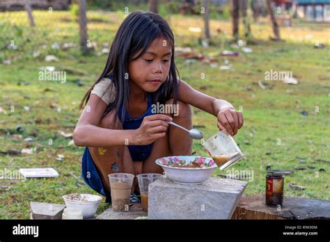 Thakhek, Laos - April 19 2018: Local chil playing to make a meal with ...
