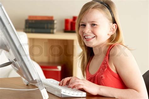 Young Girl Using Computer At Home | Stock image | Colourbox