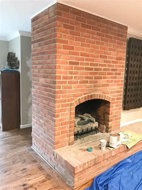 How To Paint A Red Brick Fireplace White - The DIY Nuts