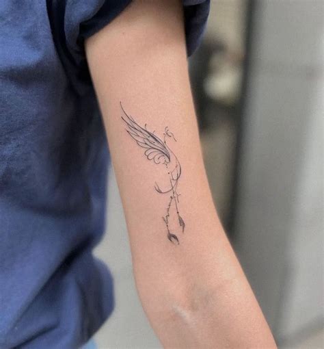 minimalist phoenix tattoo forearm small symbolism  styling tips