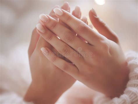 beautiful young female hands gently touching  skin close