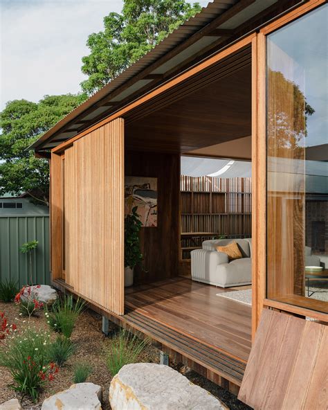 curious practice revives 'aru house' with brickwork & timber screens