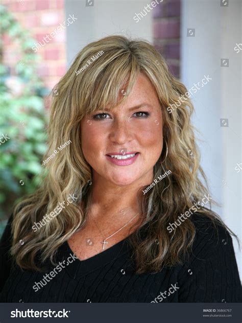 Attractive Mature Blond Haired Business Woman Stock Photo (Edit Now