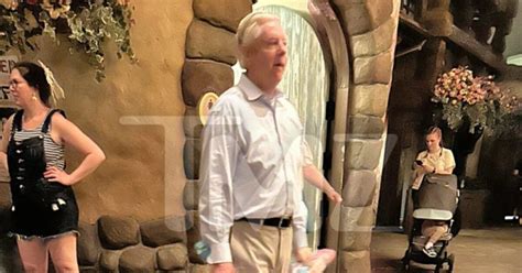 lindsey graham plays  toys  disney world   pushes  ground