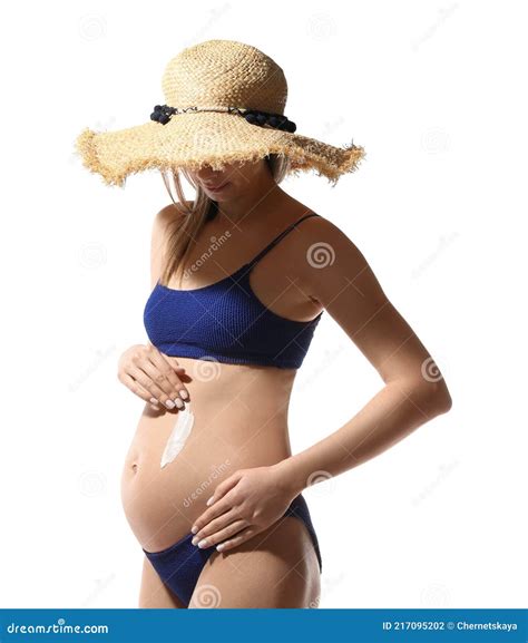 Pregnant Woman Applying Sun Protection Cream on Her Belly Against White