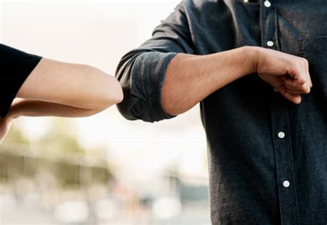 Elbow Bump Stock Photos, Pictures & Royalty-Free Images - iStock