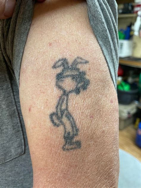 My friends dad got this tattoo of an animated rabbit during his tour