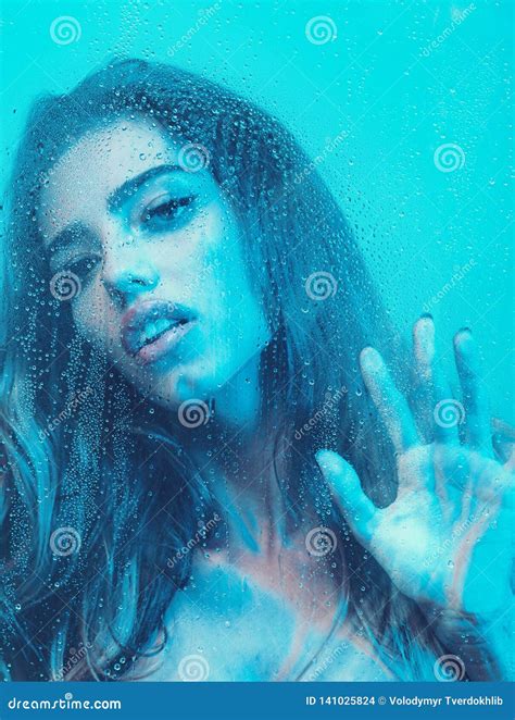 Beautiful Woman Taking a Hot Shower Focus on Face. Stock Photo - Image