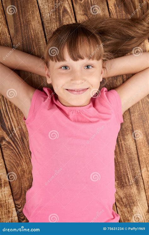 Top View of a Smiling Little Girl Lying on Back Stock Photo - Image of ...