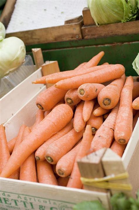 Carrots In Crate At A Market Photograph by Foodcollection