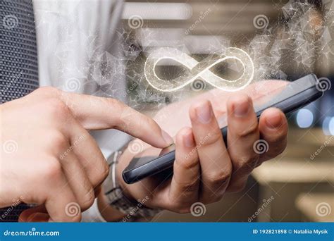 An Infinity Sign Appears from the Phone Stock Photo - Image of device ...
