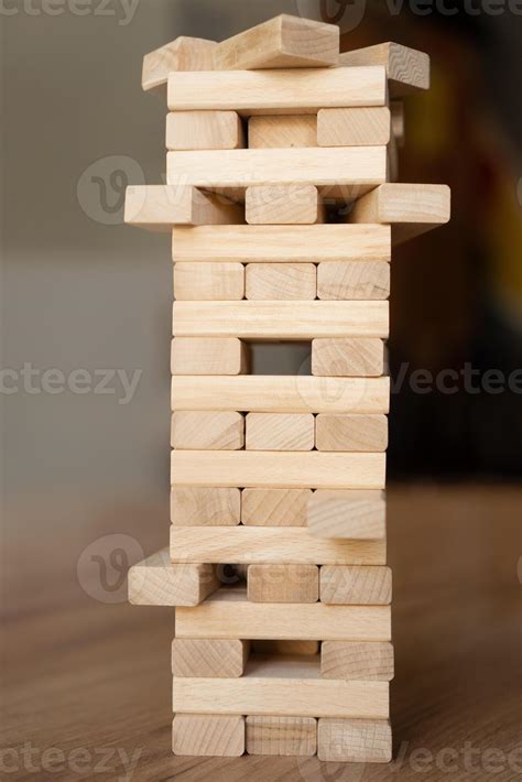 Building Business Foundations Wooden blocks tower symbolizing growth