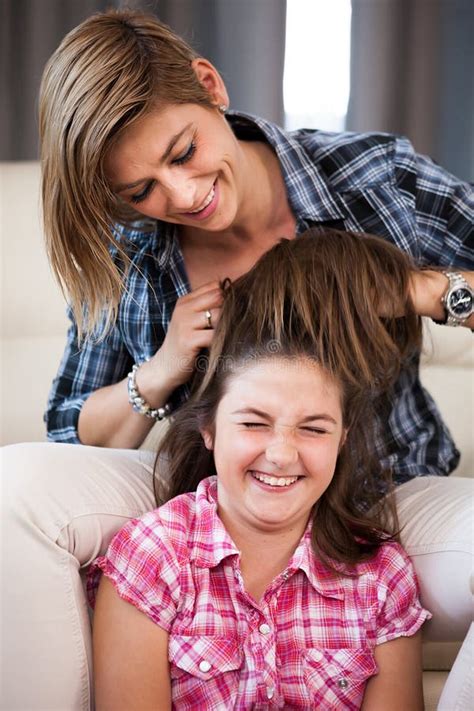 Close Up Portrait of Mother Combing Her Daughter Hair Stock Image ...