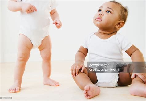 Babies Playing Together High-Res Stock Photo - Getty Images