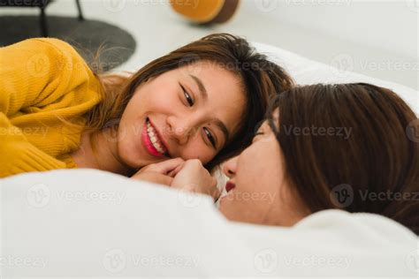 Top view of beautiful young asian women lesbian happy couple showing