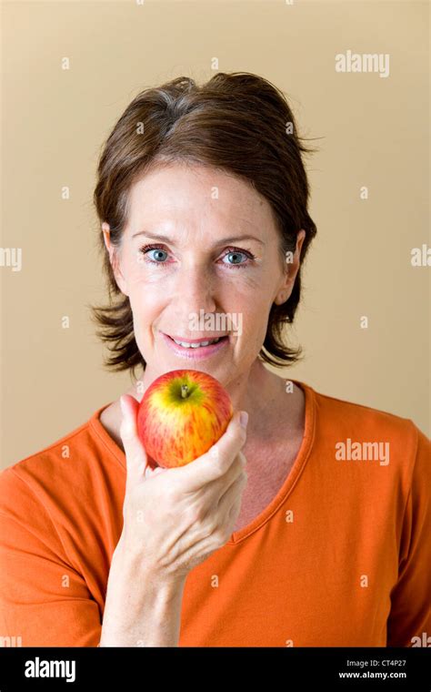 ELDERLY PERSON EATING FRUIT Stock Photo - Alamy