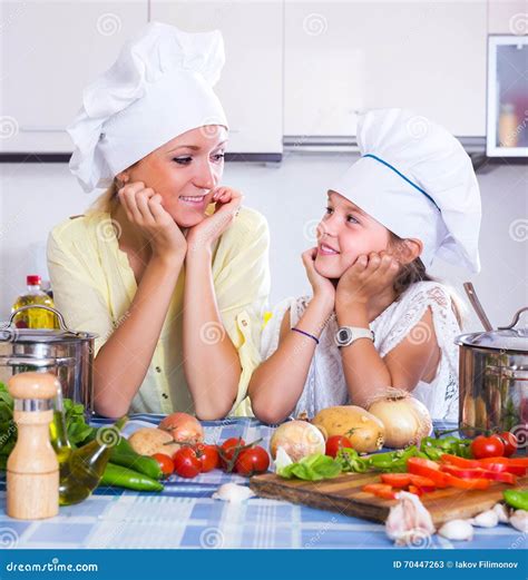 Girl Helping Mother To Prepare Stock Image - Image of healthy, leisure