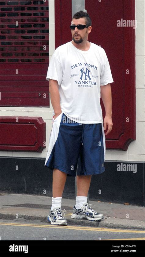 Adam Sandler out and about dressed in huge blue shorts and an oversized ...