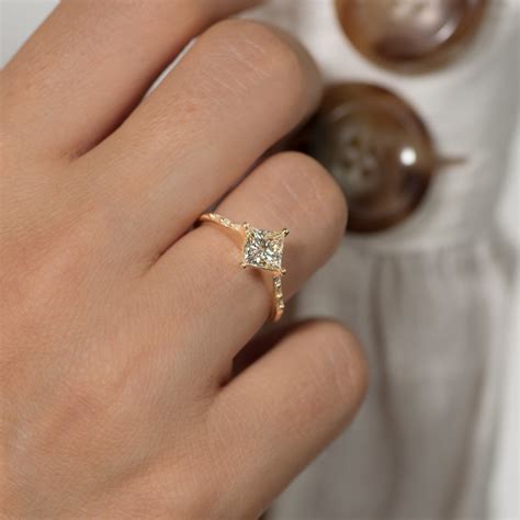 princess cut engagement ring on finger 1