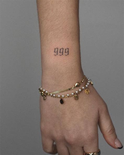 Tattoo of the number "999" located on the wrist.